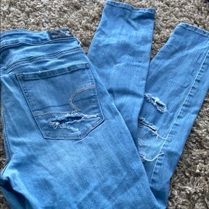 High rise, stretchy ripped light wash AE jeans